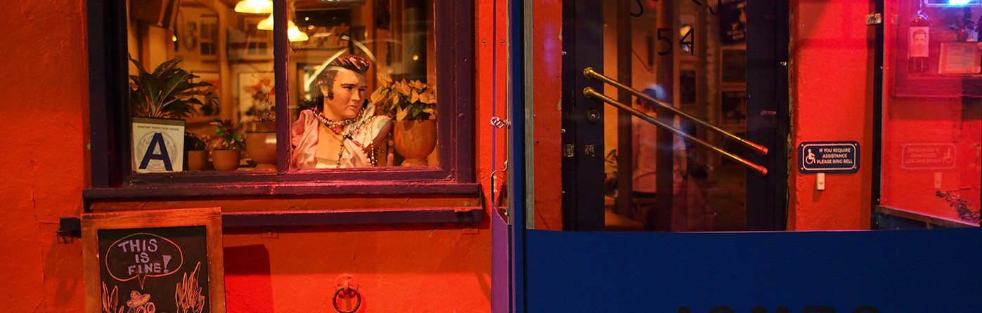 Elvis poster in window of Jones coffee shop, red