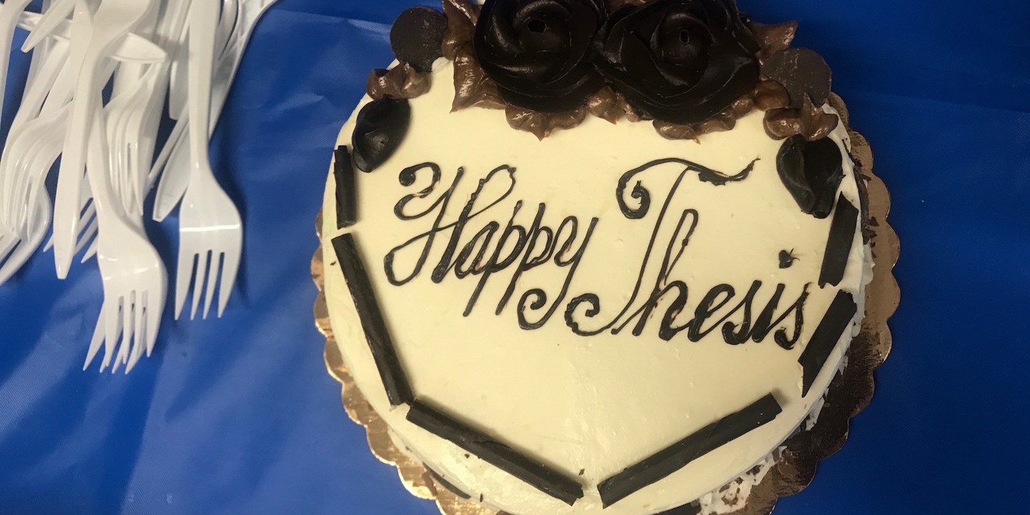 Cake with text, "Happy Thesis!"