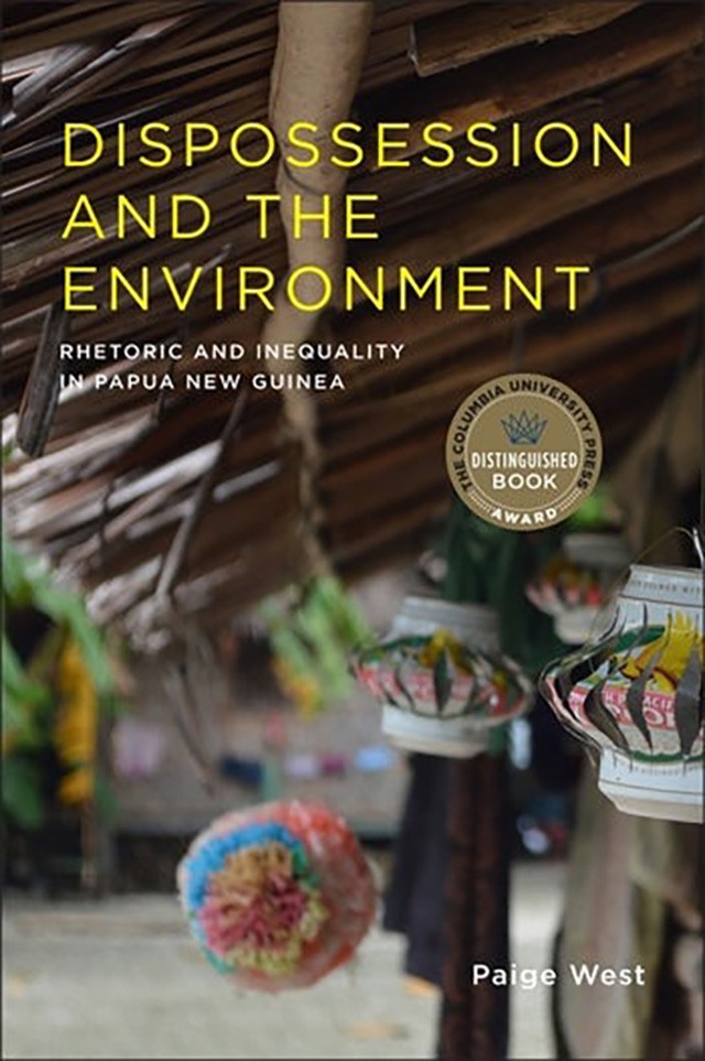 Book cover image showing the edge of a straw hut decorated with lanterns.